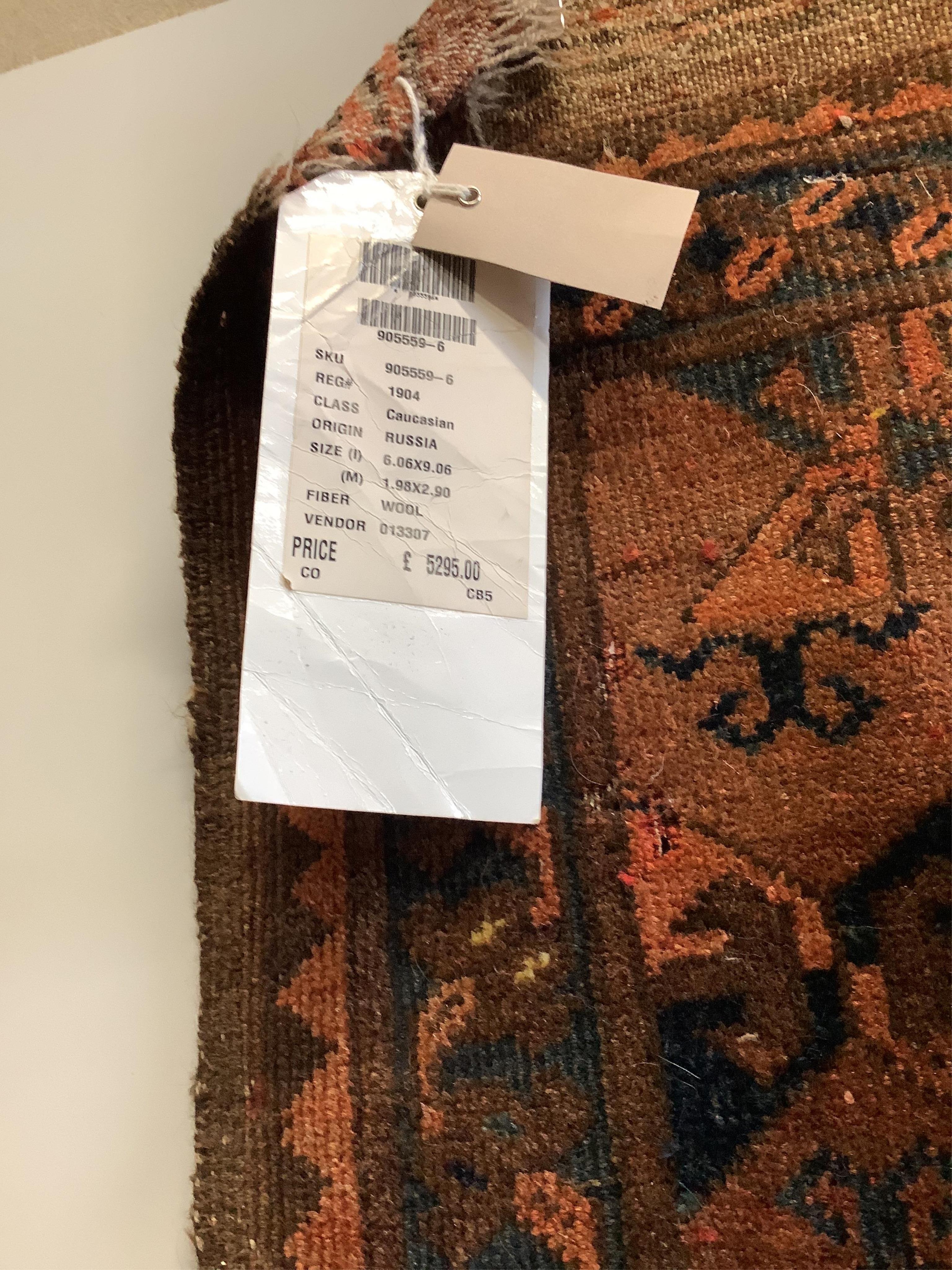 An Afghan carpet with receipt from ABC Carpet & Home of New York, 290 x 203cm. Condition - fair